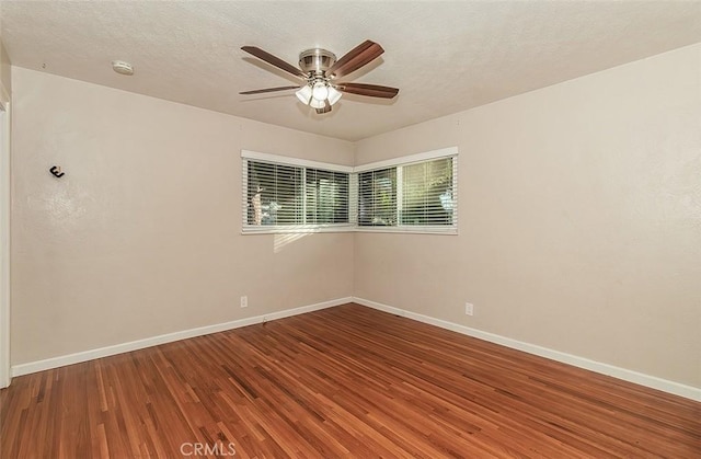 unfurnished room featuring ceiling fan, a textured ceiling, and hardwood / wood-style flooring