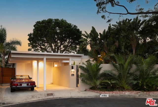 view of front facade with a carport