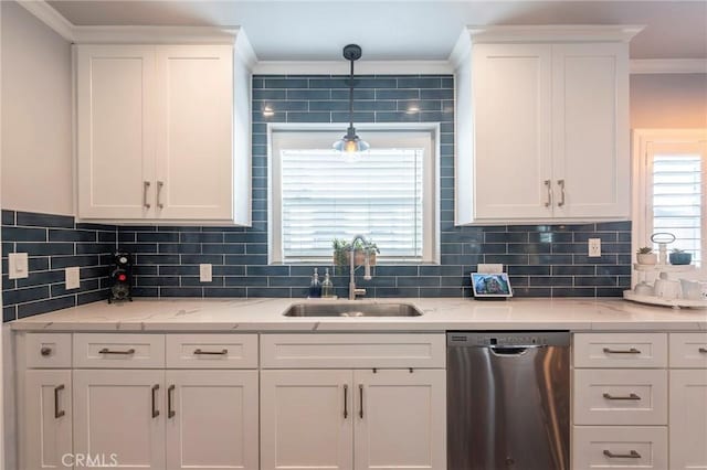 kitchen with white cabinetry, dishwasher, and sink