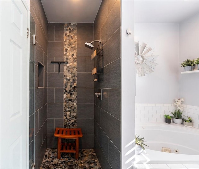 bathroom with shower with separate bathtub