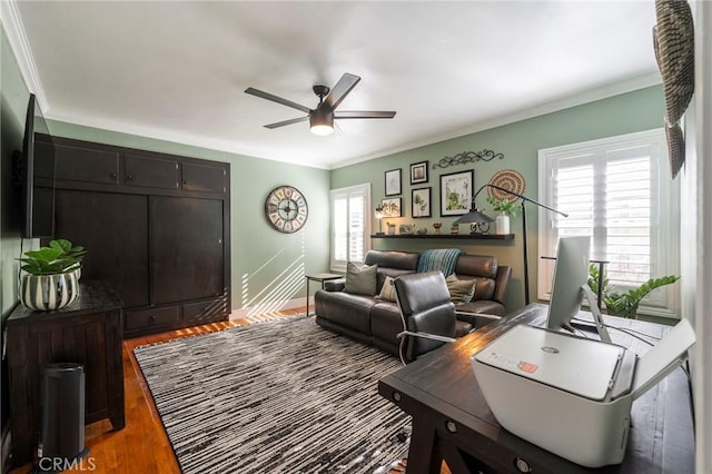 living room featuring ceiling fan, wood-type flooring, and ornamental molding