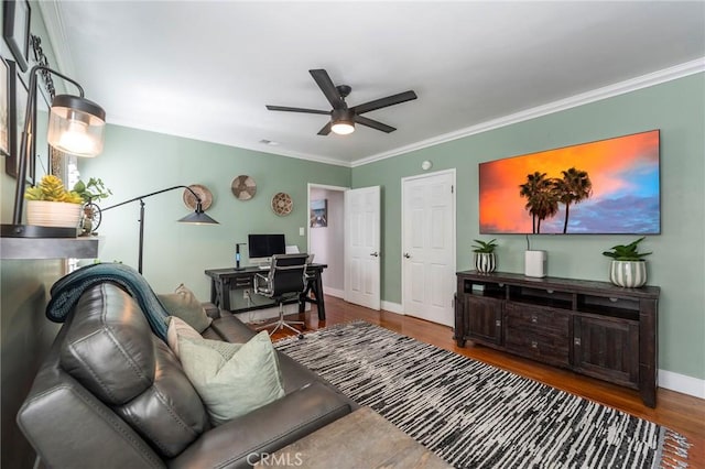 living room with ceiling fan, crown molding, and hardwood / wood-style floors