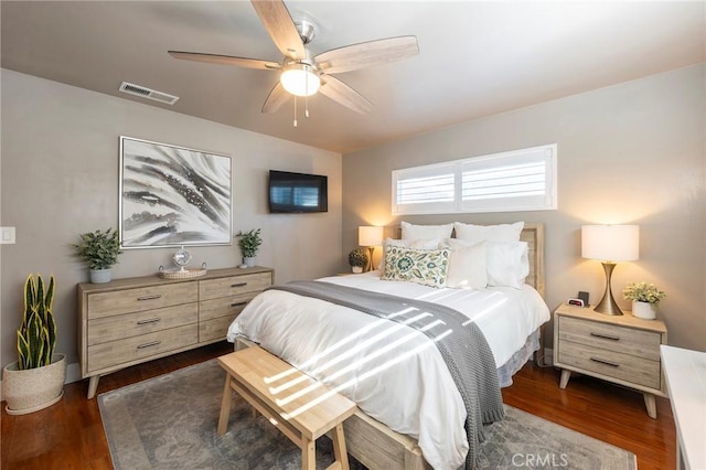 bedroom with ceiling fan and dark wood-type flooring