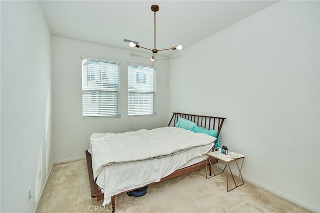 bedroom with light carpet