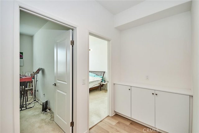 corridor featuring light hardwood / wood-style floors