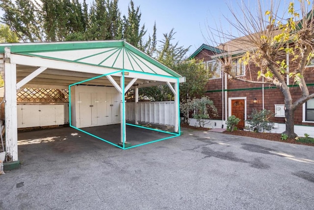 view of parking / parking lot with a carport