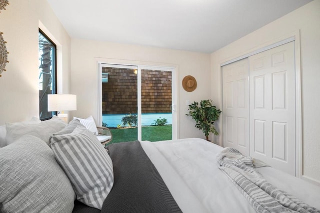 bedroom featuring a closet and access to outside