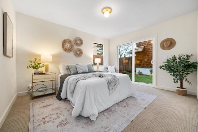 carpeted bedroom featuring access to outside