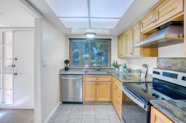 kitchen featuring extractor fan, stainless steel appliances, light brown cabinetry, stone counters, and sink