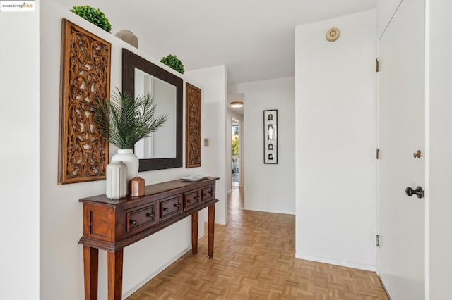 hallway featuring light parquet flooring