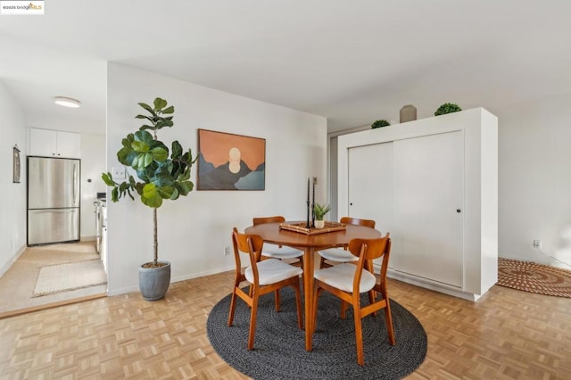 dining room with light parquet flooring