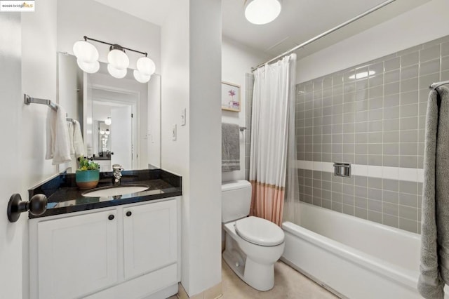 full bathroom with toilet, vanity, and shower / bath combo with shower curtain