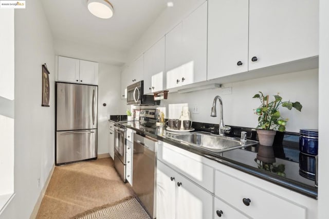 kitchen featuring white cabinets, sink, and stainless steel appliances