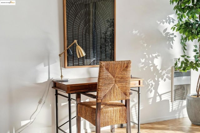 living area featuring parquet flooring