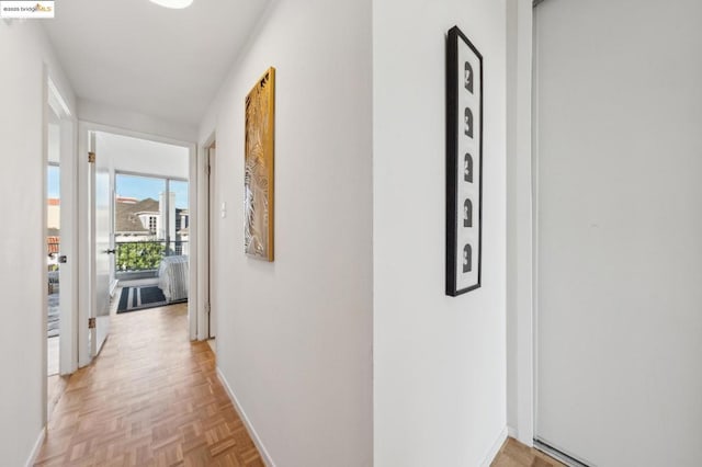 corridor featuring light parquet floors