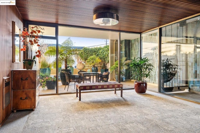 sunroom featuring wood ceiling