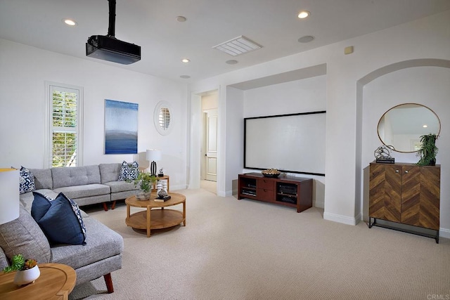 home theater room featuring light carpet, baseboards, and recessed lighting