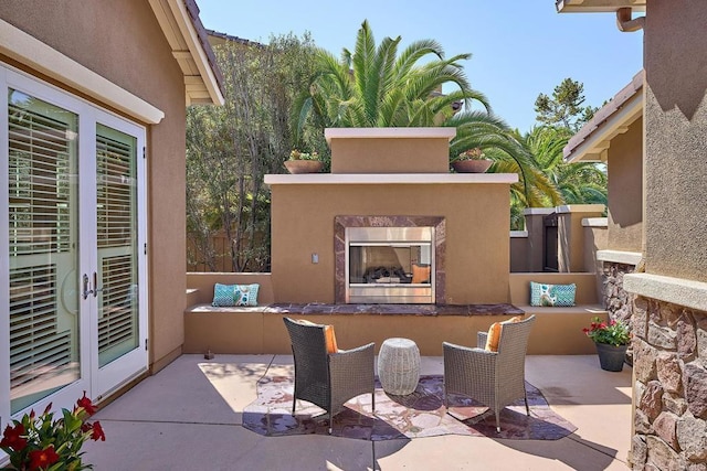 view of patio / terrace featuring an outdoor fireplace