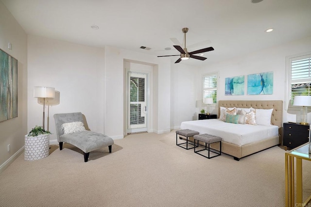 bedroom featuring light carpet, multiple windows, visible vents, and recessed lighting