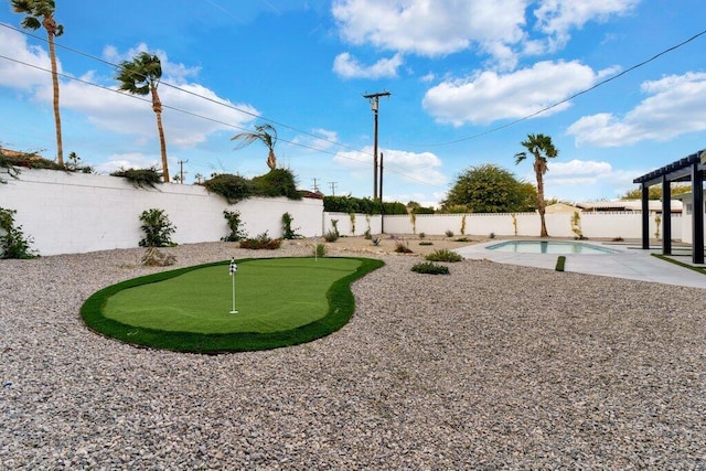 view of yard with a pergola, a fenced in pool, and a patio