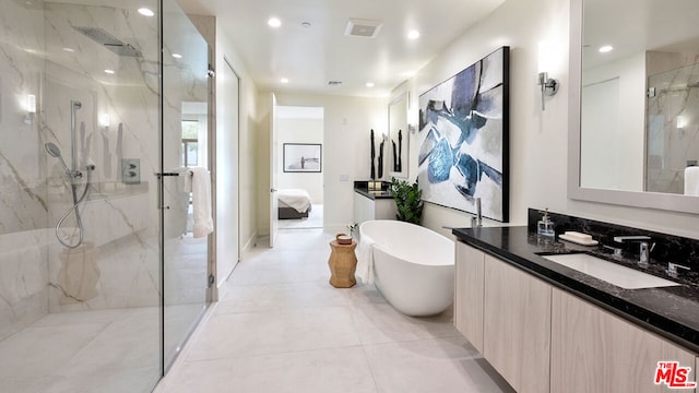 bathroom featuring plus walk in shower and vanity