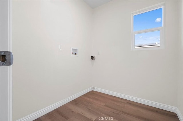 laundry room with hardwood / wood-style flooring and washer hookup