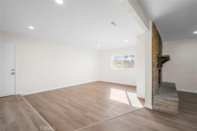 unfurnished living room featuring light wood-type flooring