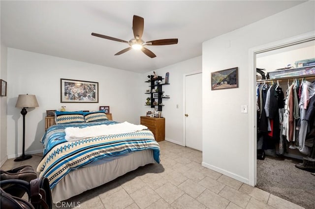 carpeted bedroom with a closet and ceiling fan