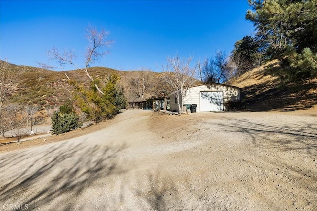 view of front of home featuring a mountain view