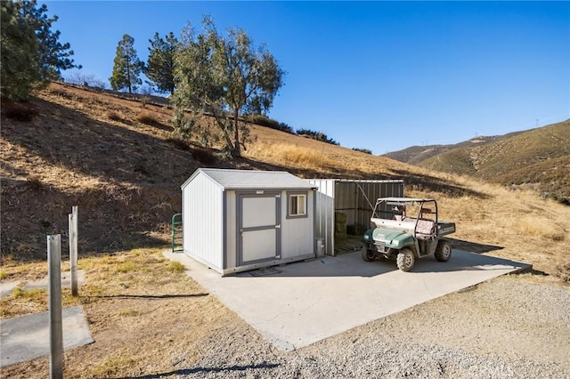 view of outdoor structure with a mountain view