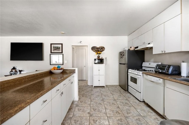 kitchen with white appliances and white cabinetry