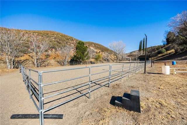 exterior space featuring a rural view and a mountain view