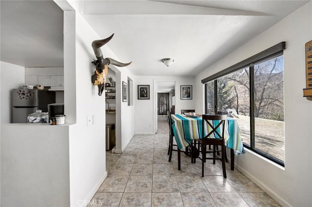 dining room with light tile patterned flooring