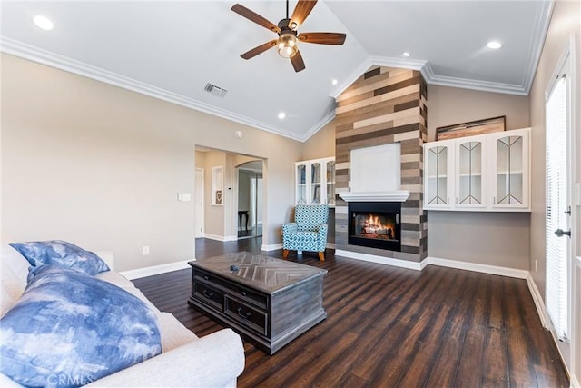 living room with ceiling fan, crown molding, dark hardwood / wood-style flooring, and lofted ceiling