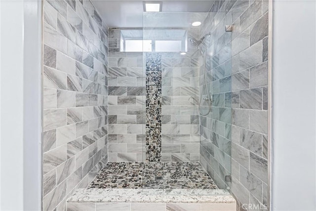 bathroom with tiled shower