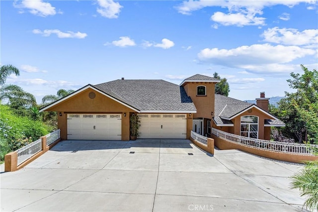 view of front of property with a garage