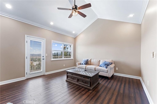 living room featuring ceiling fan, vaulted ceiling, dark wood-type flooring, and crown molding