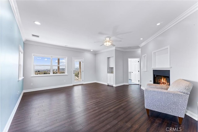 living room with ceiling fan, ornamental molding, and dark hardwood / wood-style floors