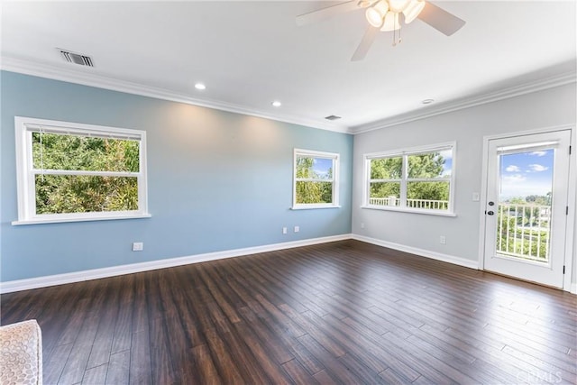 empty room with ceiling fan, crown molding, and dark hardwood / wood-style floors