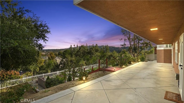 view of patio terrace at dusk