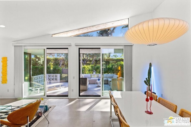 entryway with concrete floors and lofted ceiling