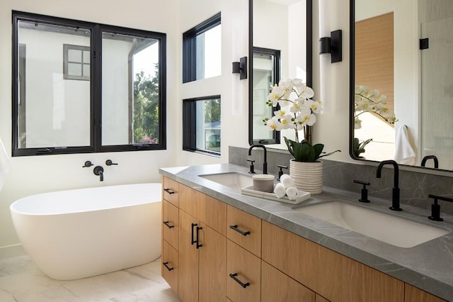 bathroom with a bathtub and vanity