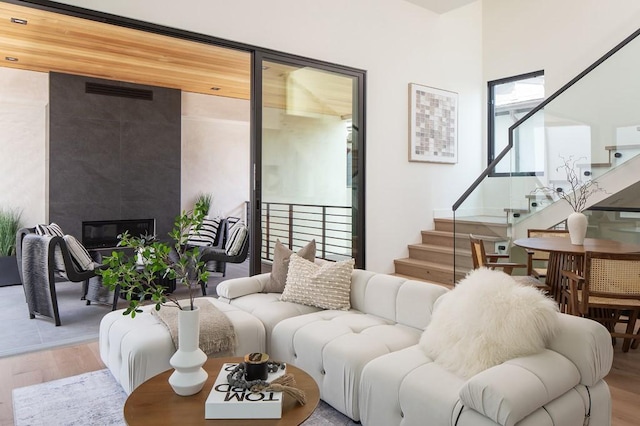 living room featuring light hardwood / wood-style flooring and a fireplace