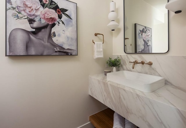 bathroom featuring vanity and tasteful backsplash