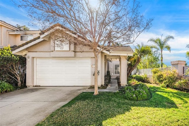 view of front of home featuring a front yard and a garage