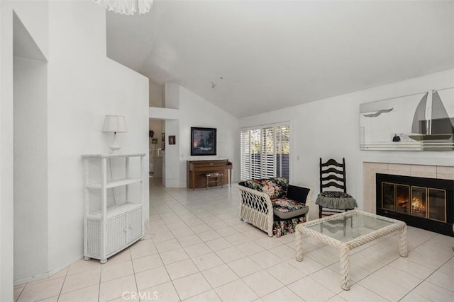 tiled living room featuring lofted ceiling and a tile fireplace