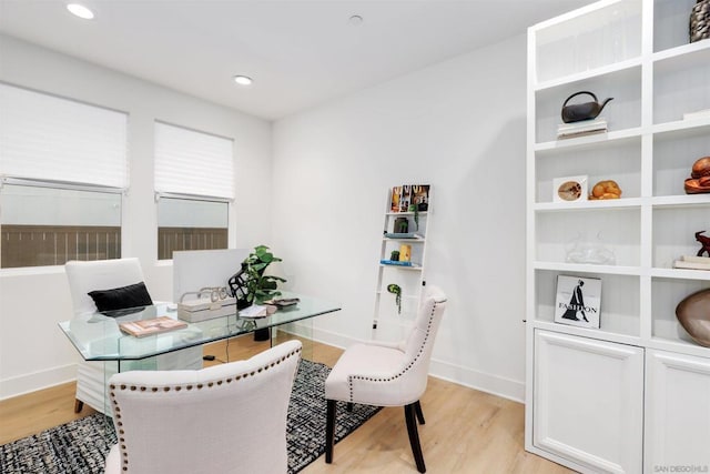 office with light hardwood / wood-style flooring