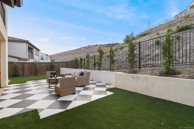 view of patio / terrace with a mountain view and outdoor lounge area