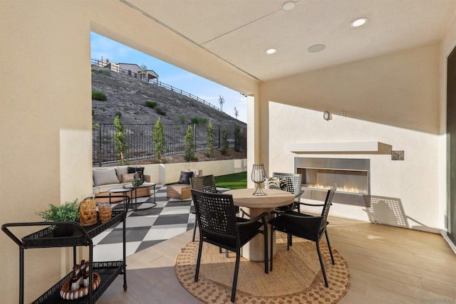 view of patio / terrace featuring an outdoor living space with a fireplace