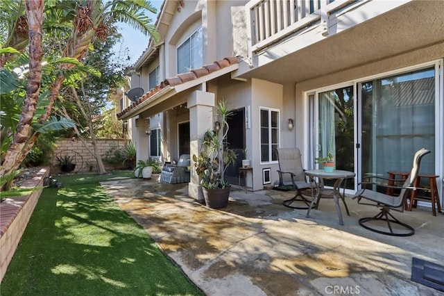 view of patio featuring a balcony